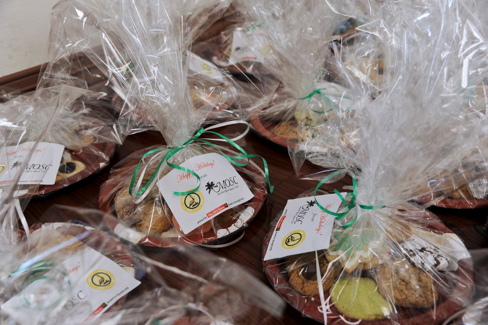 Plates of homemade cookies wait to be delivered to dorm residents for Operation Cookie Drop 2015 at MacDill Air Force Base, Fla., Dec. 8, 2015. The MacDill officers’ and enlisted spouses’ clubs hosted the event to bring holiday cheer to young military members who may be away from home for the first time. (U.S. Air Force photo by Senior Airman Danielle Quilla) 