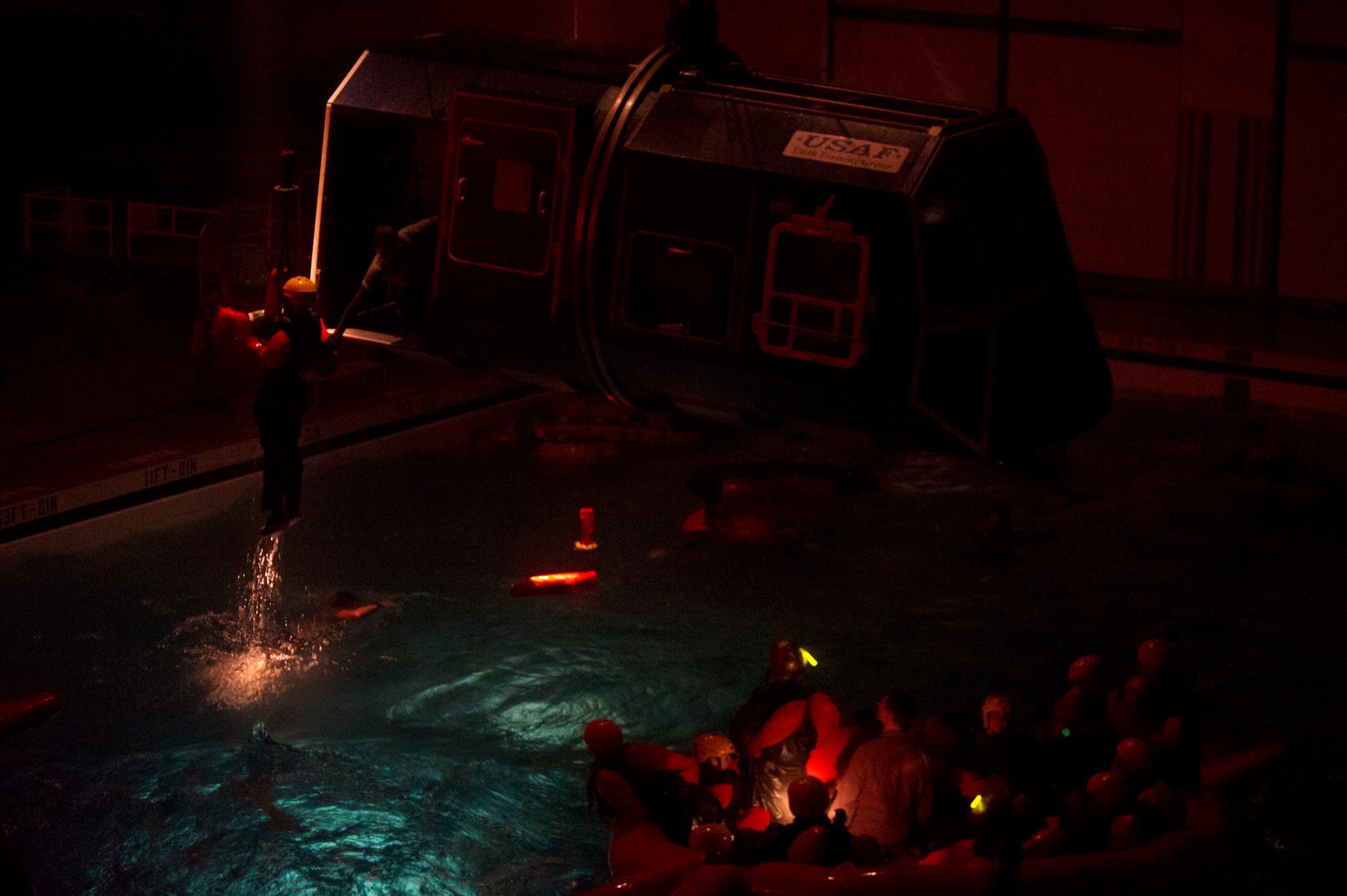 A water survival student is hoisted during a simulated rescue operation Dec. 8, 2015, at Fairchild Air Force Base, Wash. Students attended the survival school’s Water Survival Course to learn skills that will aid them if they become isolated personnel in open water, sea or ocean. (U.S. Air Force photo/Airman 1st Class Nick J. Daniello)