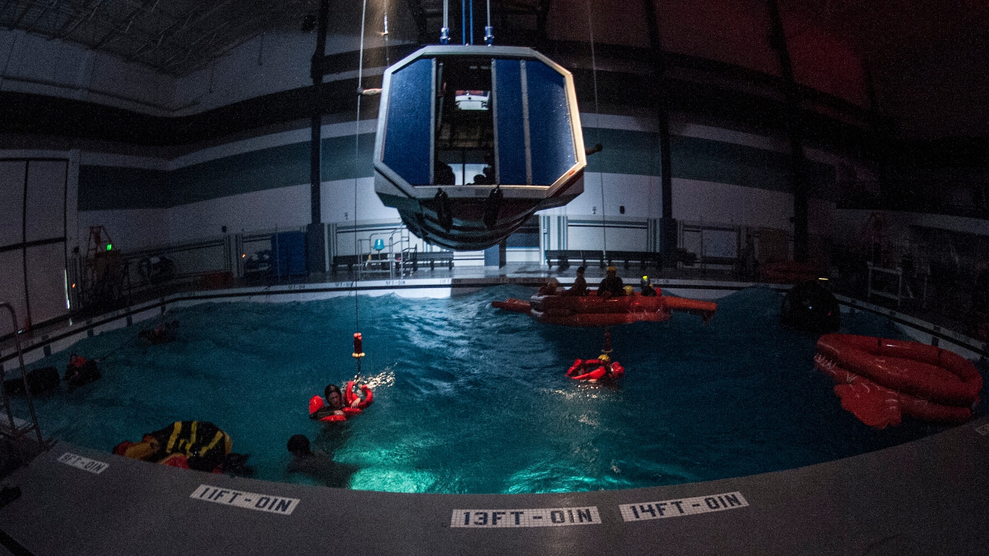 Water Survival students get hands on training on what to do if a helicopter goes down over the ocean Dec. 8, 2015, at Fairchild Air Force Base, Wash. Survival, Evasion, Resistance and Escape instructors learn everything they need to know to teach the course in technical school. Before becoming an instructor for water survival, instructors go through a refresher course ensuring they know the information and comprehend the lessons that need to be taught. (U.S. Air Force photo/Airman 1st Class Sean Campbell)