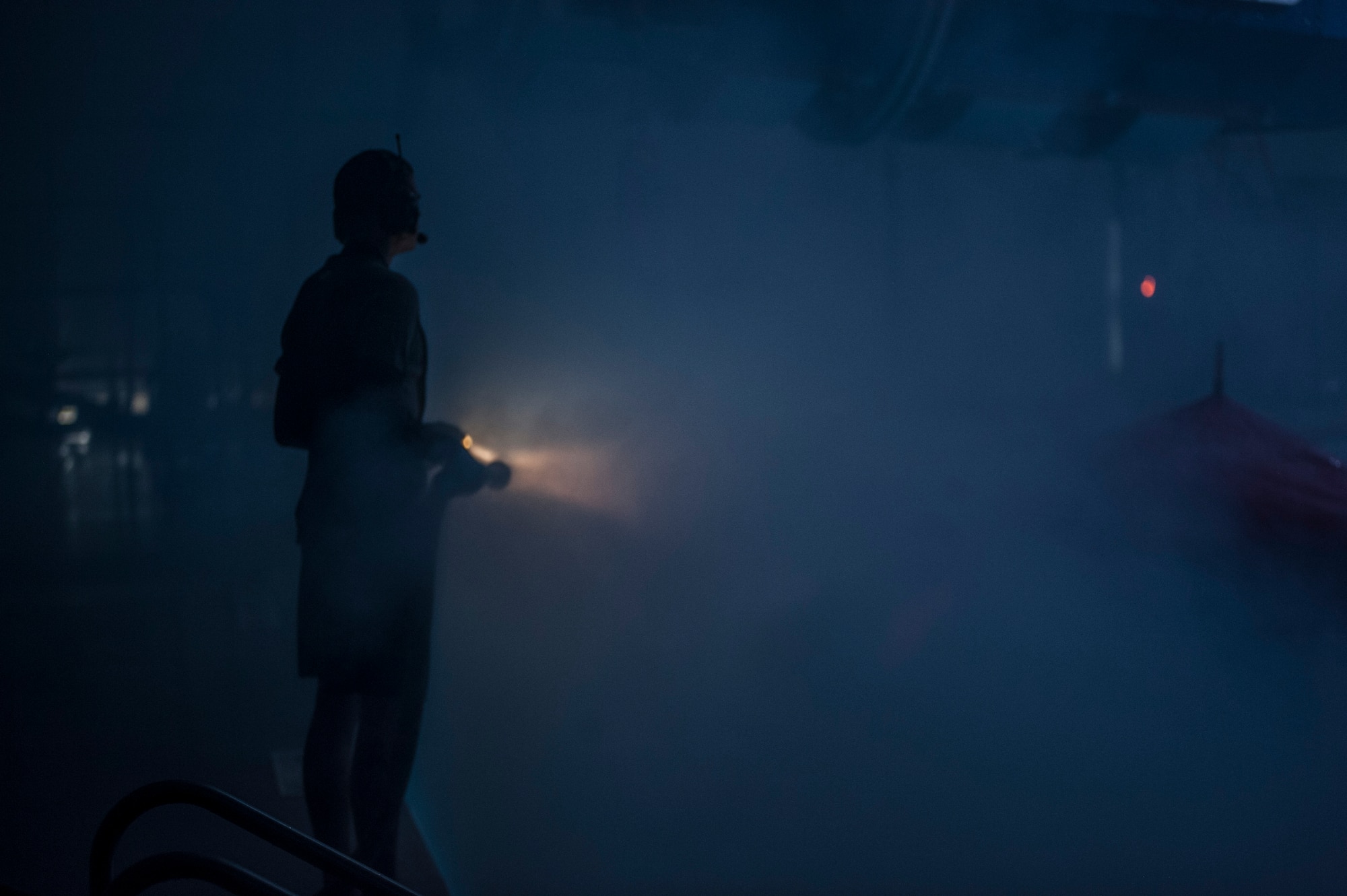 A Survival, Evasion, Resistance and Escape instructor sprays students with water during a training scenario Dec. 8, 2015, at Fairchild Air Force Base, Wash. For the “dunker” portion of the course, S.E.R.E specialists are certified through the Navy Salvage Dive because Water Survival students will be breathing on compressed air in the form of a Helicopter Emergency Egress Device bottle. (U.S. Air Force photo/Airman 1st Class Sean Campbell)