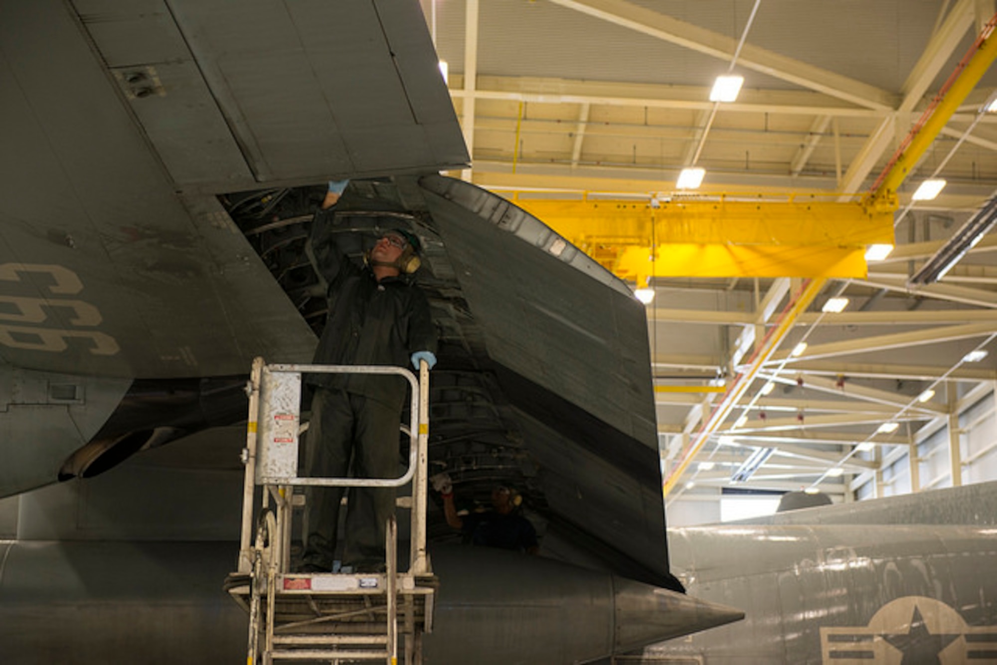 Sailors from Fleet Logistics Support Squadron 64 scrub the exterior of a C-130 Hercules on Joint Base McGuire-Dix-Lakehurst, N.J. Dec. 9. The Sailors wash each of their 5 C-130's every 105 days to protect from corrosion. 