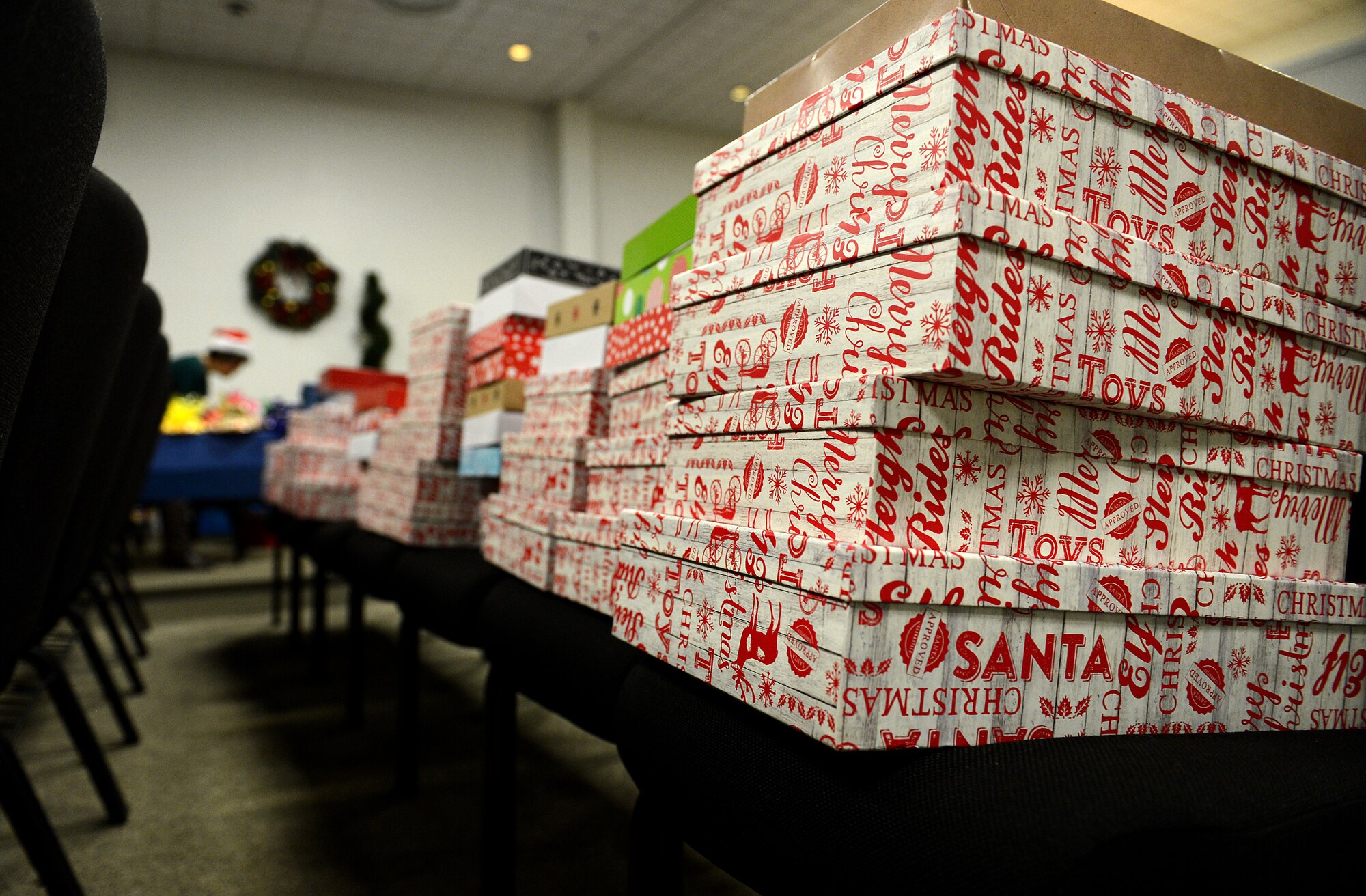 Boxes of cookies are filled and placed on chairs at McChord Field Chapel Support Center before being delivered to Airmen Dec. 9, 2015 on McChord Field, Wash. Operation Cookie Drop is a program in which base residents and community members donate homemade cookies to be hand delivered during the holidays from the McChord First Sergeants to the Airmen in the dorms. (U.S. Air Force photo/Senior Airman Divine Cox)