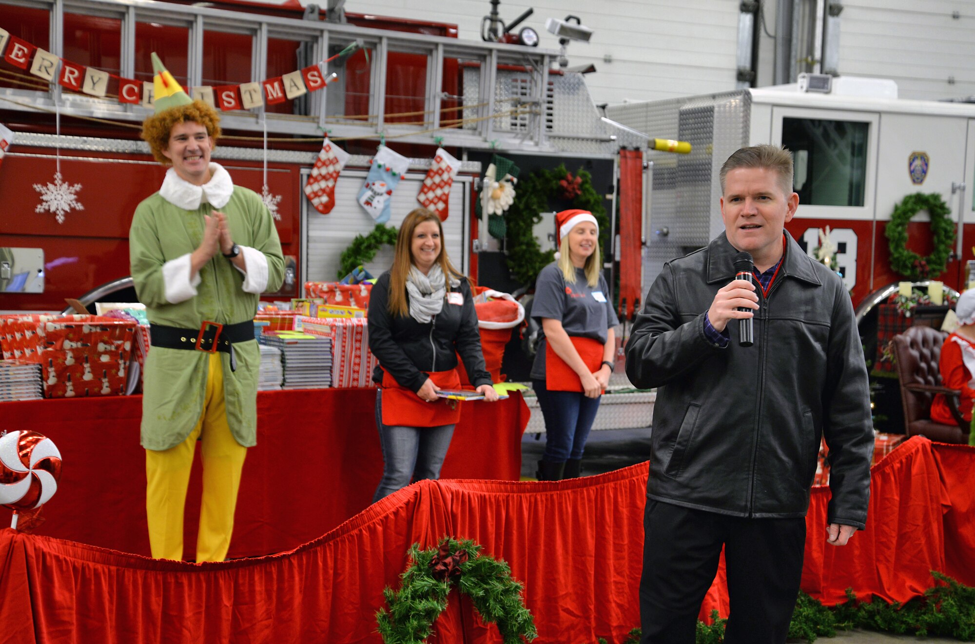 U.S. Air Force Col. Thomas Torkelson, right, 100th Air Refueling Wing commander, thanks Team Mildenhall families for attending the Hearts Apart event Dec. 12, 2015, on RAF Mildenhall, England. The event was hosted by the 100th Force Support Squadron along with the Mildenhall Spouses’ Club. Families enjoyed food, games and Christmas-themed crafts. (U.S. Air Force photo by Senior Airman Christine Halan/Released)