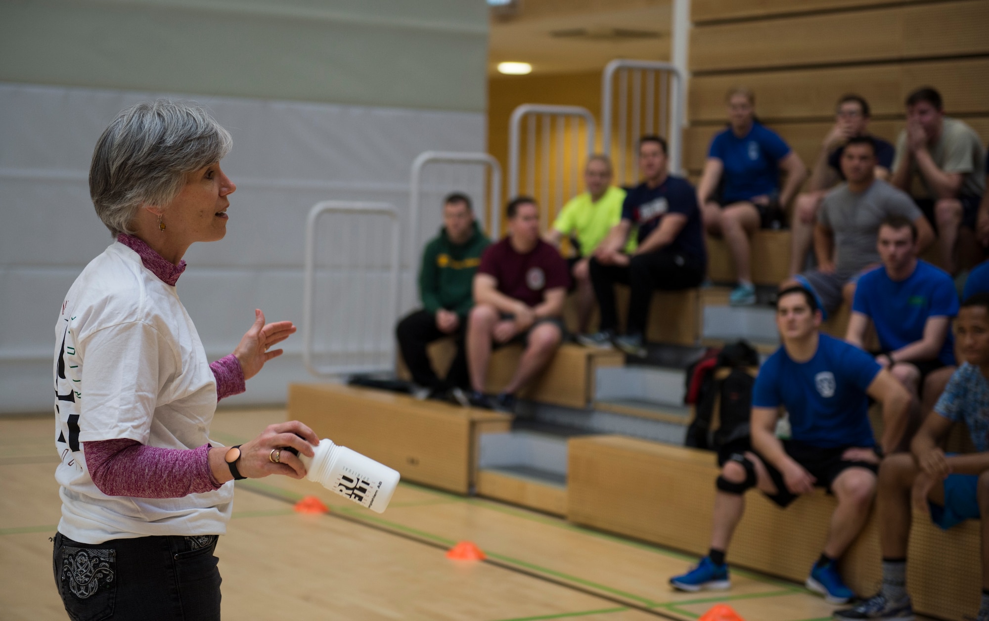 Helena Palmer, 52nd Fighter Wing community support coordinator, thanks Airmen for participating in the RUFit Dodgeball Tournament in the fitness center Dec. 11, 2015, at Spangdahlem Air Base, Germany. Coed teams of 5-7 players could participate in the combat fitness-style dodgeball tournament. (U.S. Air Force photo by Staff Sgt. Christopher Ruano/Released)