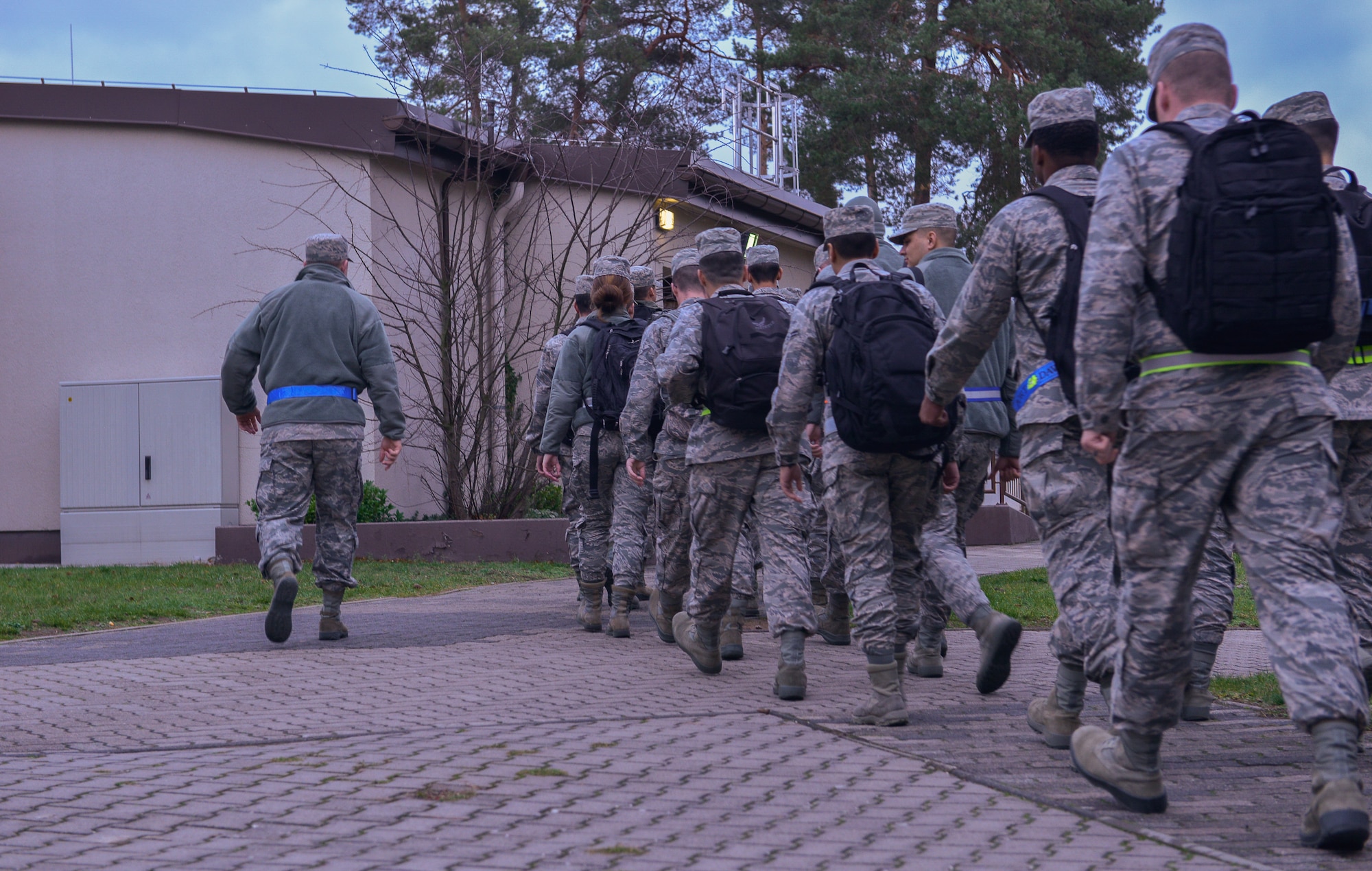 Senior Airman John Burchfield, 86th Force Support Squadron First Term Airman’s Center lead, walks his FTAC flight to the Airman’s Attic Dec. 14, 2015, at Ramstein Air Base, Germany. As Airmen go through FTAC, their leads show them around base to help them adjust to their first operational base. (U.S. Air Force photo/Airman 1st Class Lane T. Plummer)