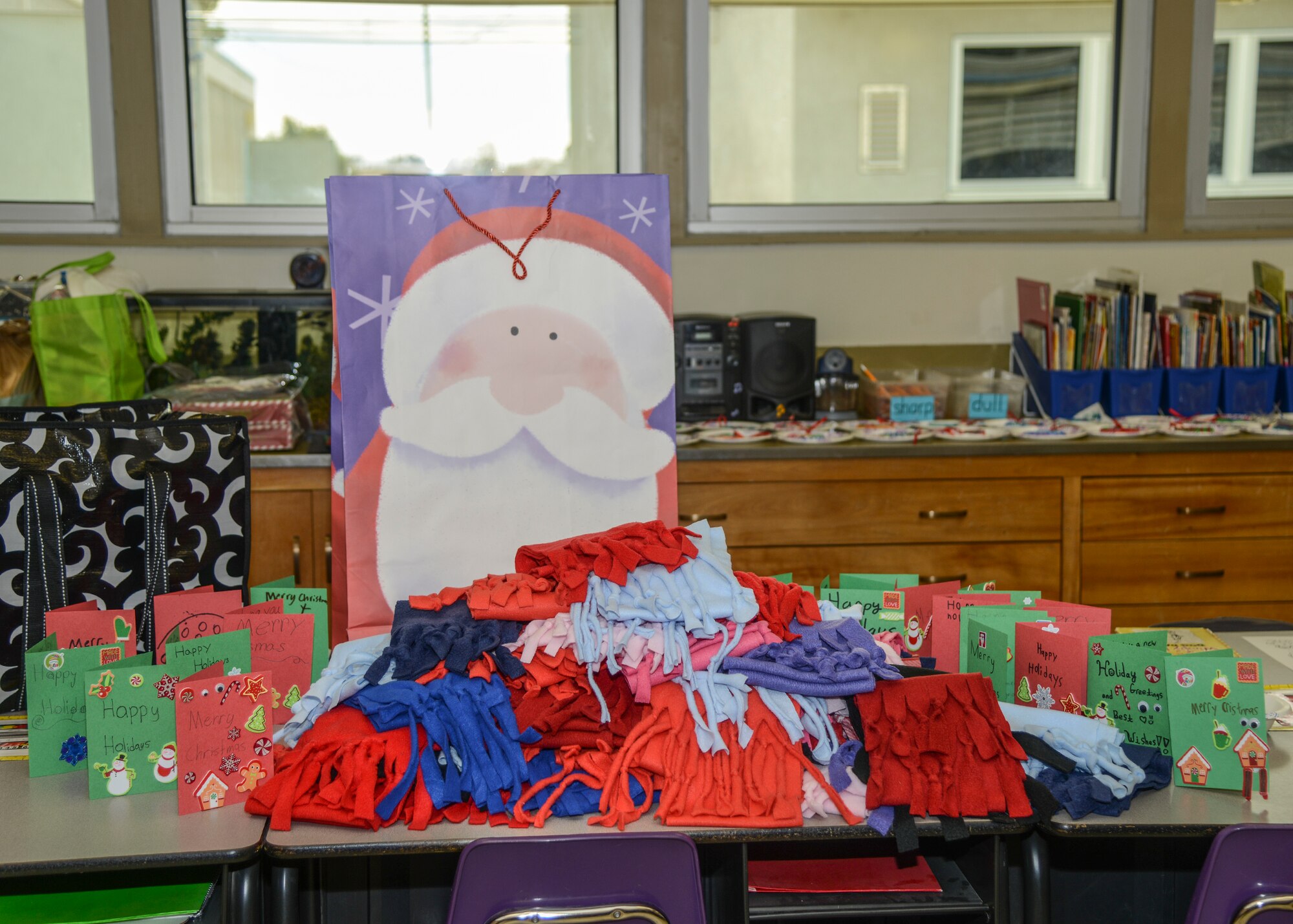 Finished scarves and Christmas cards wait to be delivered to a Lancaster, California, homeless shelter. (U.S. Air Force photo by Rebecca Amber)