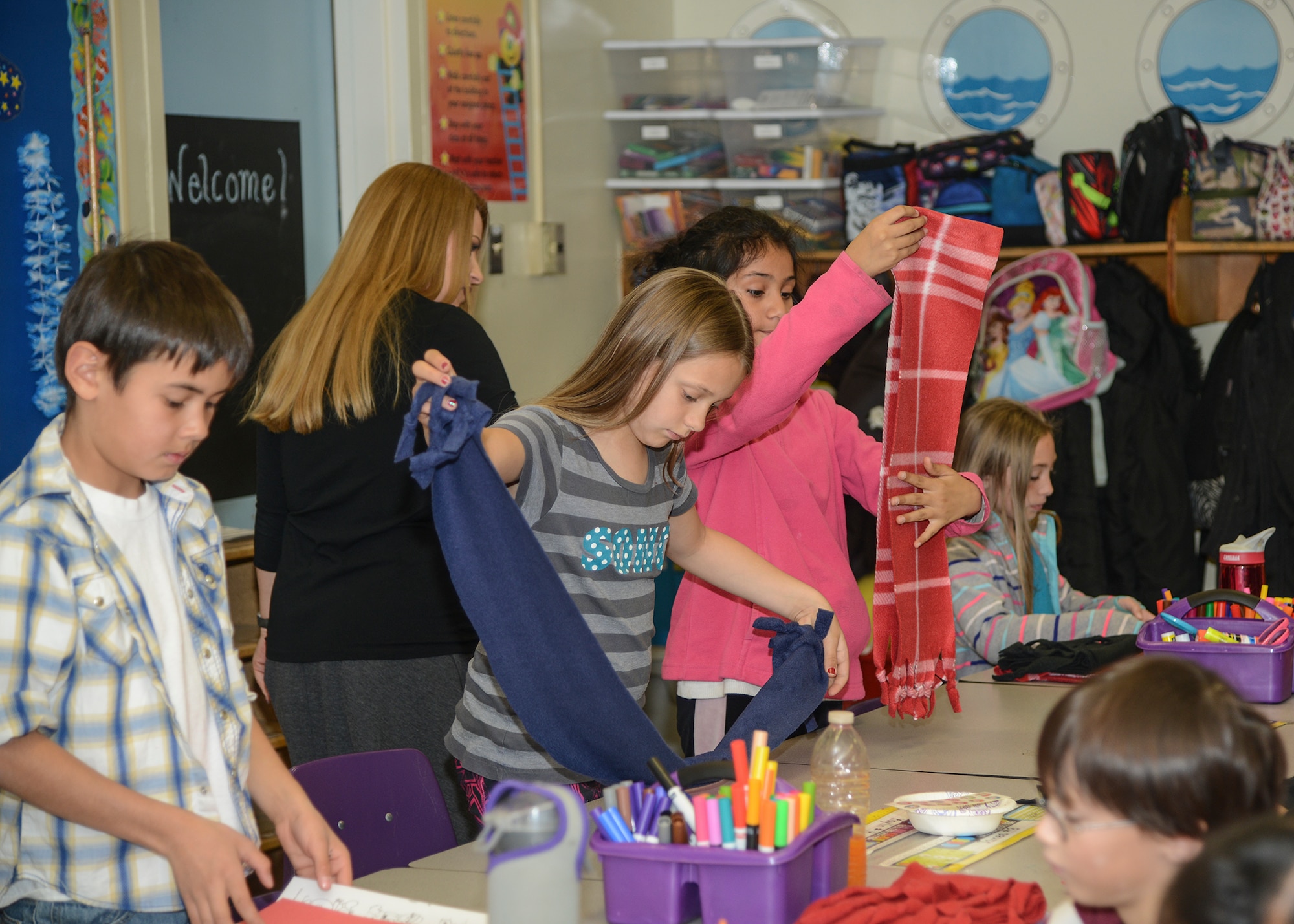 Elizabeth Davis’ fourth grade class at Branch Elementary School prepared 60 fleece scarves Dec, 10 to donate to the Lancaster Community Shelter. The scheduled delivery date for the scarves is Dec. 17, just in time for Christmas. (U.S. Air Force photo by Rebecca Amber)