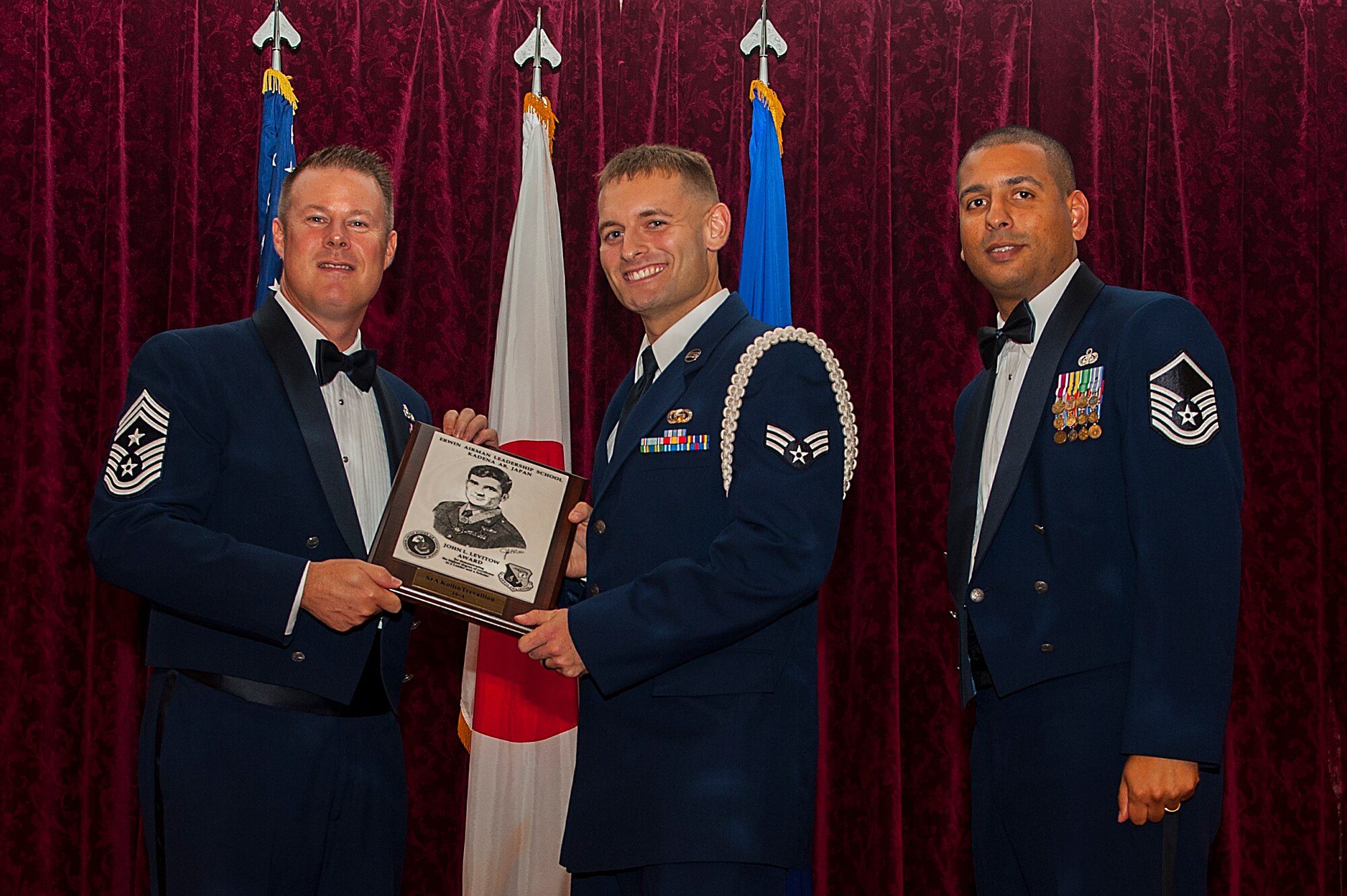 U.S. Air Force Senior Airman Kollin Trevallion, 390th Intelligence Squadron and Airman Leadership School graduate, receives the John L. Levitow Award during ALS Class 16-A’s graduation ceremony Dec. 10, 2015, at Kadena Air Base, Japan. This award is presented to the student who earns the highest average score on evaluations and most embodies the Air Force core values. (U.S. Air Force photo by Airman 1st Class Corey M. Pettis)