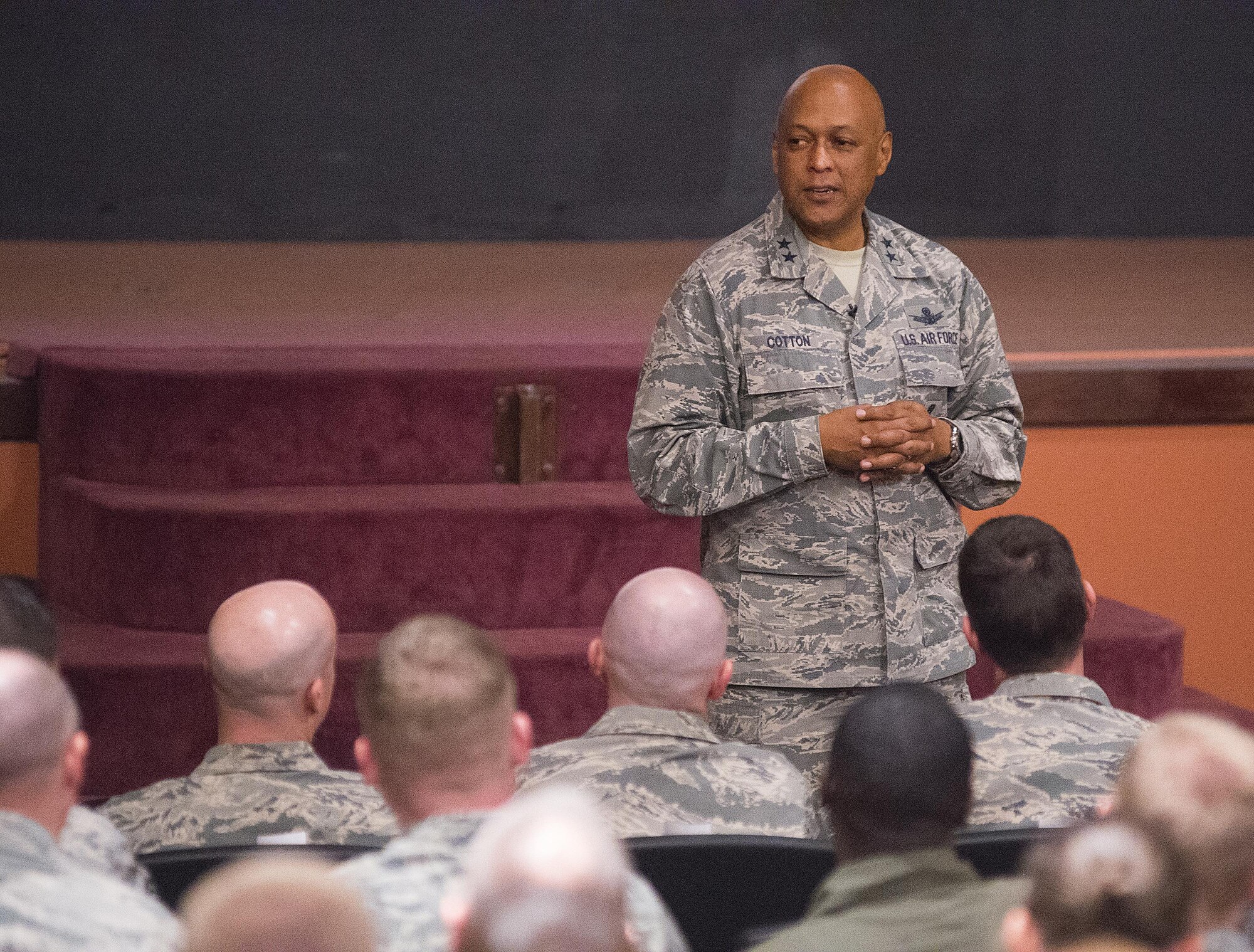 Maj. Gen. Tony Cotton, 20th Air Force and Combined Task Force 214 commander,  talks to 90th Missile Wing and 20th AF Headquarters Airmen during a commander's call in the F.E. Warren Air Force Base, Wyo., base theater Dec. 9, 2015. Cotton recently visited most of the wings of the 20th AF, which he assumed command of on Nov. 16. (U.S. Air Force photo by R.J. Oriez)