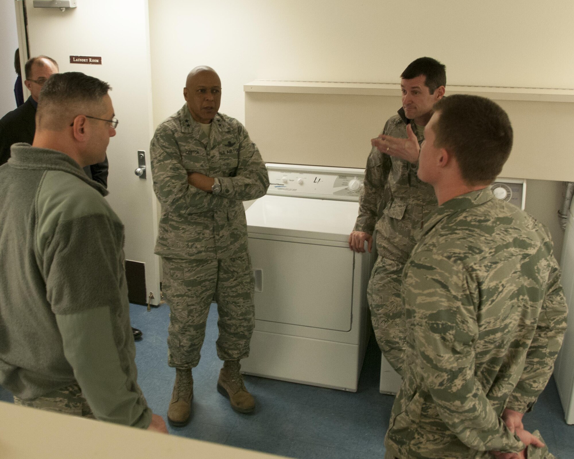Maj. Gen. Tony Cotton, 20th Air Force and Task Force 214 commander, listens during his tour of a dormitory on F.E. Warren Air Force Base, Wyo., Dec. 9, 2015. Cotton assumed command of the 20th AF and TF-214 Nov. 16. (U.S. Air Force photo by Airman 1st Class Malcolm Mayfield)