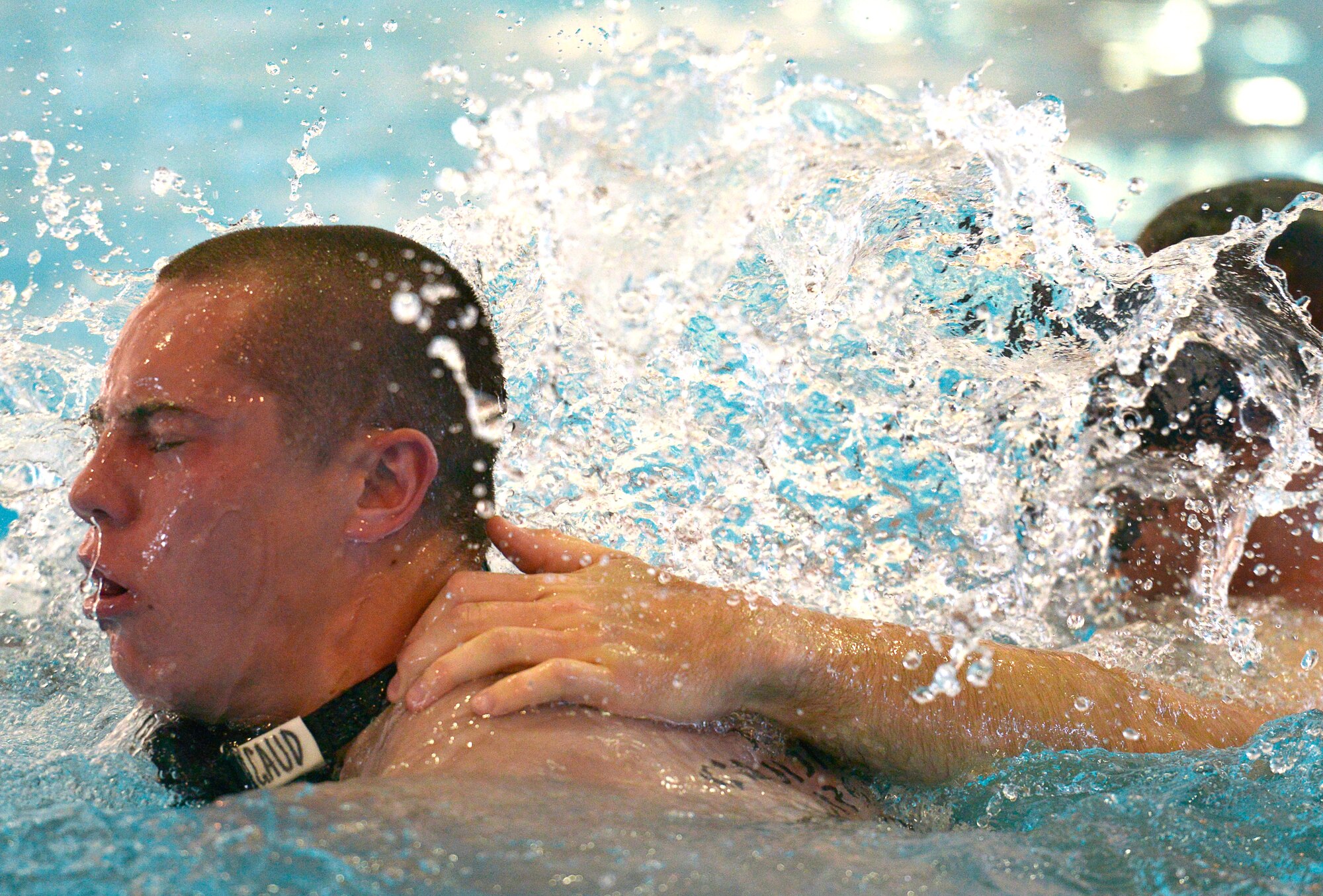 A special tactics training student break for air during a controlled breathing exercise. Students are subjected to stressful events in the pool in order to prepare them for actual tactical water operations. (U.S. Air Force photo/Staff Sgt. Christopher Griffin)