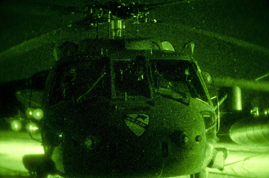 As seen through a night-vision device, a U.S. Army UH-60 Black Hawk helicopter arrives on Mihail Kogalniceanu Air Base, Romania, Dec. 9, 2015. The Black Hawk brought U.S. soldiers with the 3rd Battalion, 227th Aviation Regiment to the base to support Operation Atlantic Resolve. U.S. Army photo by Staff Sgt. Steven M. Colvin