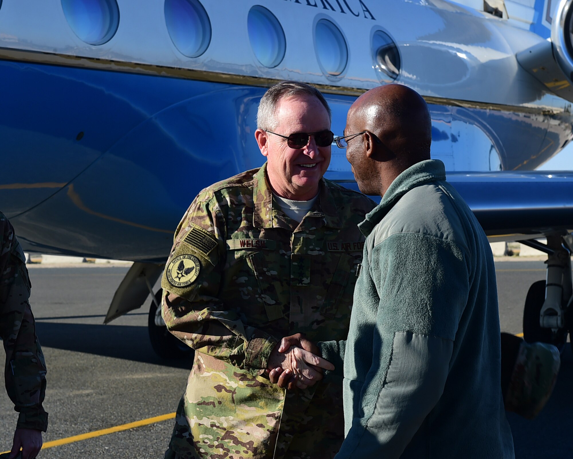 Col. Clarence Lukes Jr., 386th Air Expeditionary Wing commander, greets Chief of Staff of the Air Force Gen. Mark A. Welsh III upon arrival on the flightline at an undisclosed location in Southwest Asia Dec. 10, 2015. Welsh visited various bases in the area of responsibility speaking with Airmen deployed in support of Operation INHERENT RESOLVE. (U.S. Air Force photo by Staff Sgt. Jerilyn Quintanilla)