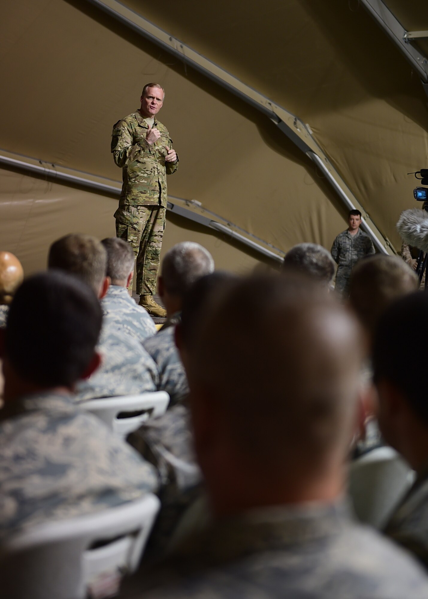 Chief Master Sgt. of the Air Force James A. Cody speaks to Airmen currently deployed to the 332nd Air Expeditionary Wing at an undisclosed location in Southwest Asia, Dec. 10, 2015. During the visit Cody and Air Force Chief of Staff Gen. Mark A. Welsh III hosted an all-call during which they expressed gratitude and thanks for the hard work and sacrifices the Airmen make in support of Operation INHERENT RESOLVE. (U.S. Air Force photo by Staff Sgt. Jerilyn Quintanilla)