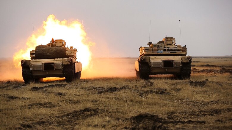 U.S. Marines with Combined Arms Company, Black Sea Rotational Force, fire an M1H1 Abrams Tank during Platinum Lynx 16-2 at Smardan Training Area, Romania, Dec. 9, 2015. Exercise Platinum Lynx 16-2 is a NATO-led multinational exercise designed to strengthen combat readiness, increase improve collective capabilities, and maintain proven relationships with allied and partner nations. (U.S. Marine Corps photo by Lance Cpl. Melanye E. Martinez/Released)