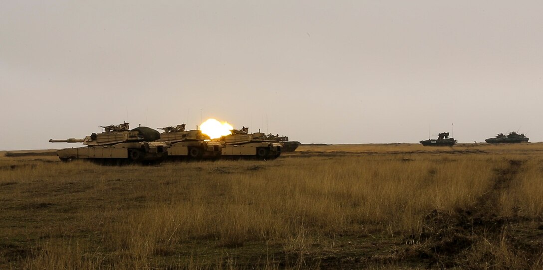 U.S., Romanian, and Moldovan military members participate in a tank shoot rehearsal during Platinum Lynx 16-2 at Smardan Training Area, Romania, Dec. 9, 2015. Exercise Platinum Lynx 16-2 is a NATO-led multinational exercise designed to strengthen combat readiness, increase improve collective capabilities, and maintain proven relationships with allied and partner nations. (U.S. Marine Corps photo by Lance Cpl. Melanye E. Martinez/Released)