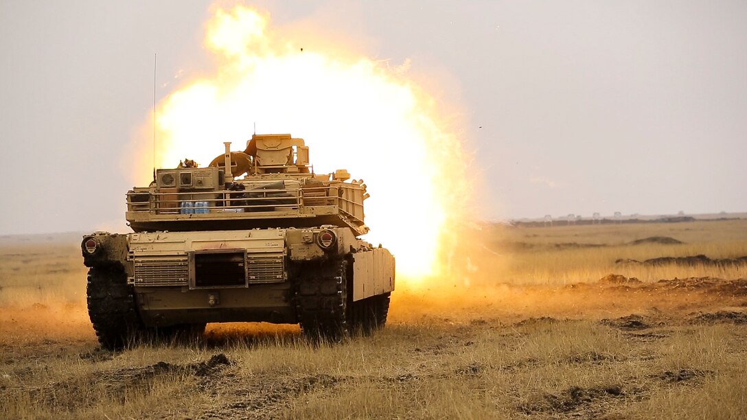 U.S. Marines with Combined Arms Company, Black Sea Rotational Force, fire an M1H1 Abrams Tank during Platinum Lynx 16-2 at Smardan Training Area, Romania, Dec. 9, 2015. Exercise Platinum Lynx 16-2 is a NATO-led multinational exercise designed to strengthen combat readiness, increase improve collective capabilities, and maintain proven relationships with allied and partner nations. (U.S. Marine Corps photo by Lance Cpl. Melanye E. Martinez/Released)