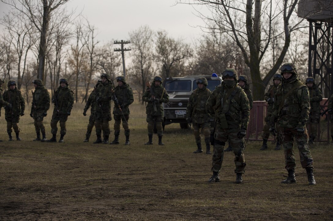 U.S. Marines with Combined Arms Company, Black Sea Rotational Force, conduct field training with Romanian and Moldovan armed forces during Platinum Lynx 16-2 at Smardan Training Area, Romania, Dec. 9, 2015. Exercise Platinum Lynx 16-2 is a NATO-led multinational exercise designed to strengthen combat readiness, increase improve collective capabilities, and maintain proven relationships with allied and partner nations. (U.S. Marine Corps photo by Lance Cpl. Melanye E. Martinez/Released)