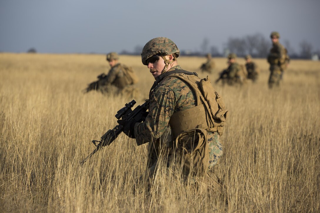 U.S. Marines with Combined Arms Company, Black Sea Rotational Force, conduct field training with Romanian and Moldovan armed forces during Platinum Lynx 16-2 at Smardan Training Area, Romania, Dec. 9, 2015. Exercise Platinum Lynx 16-2 is a NATO-led multinational exercise designed to strengthen combat readiness, increase improve collective capabilities, and maintain proven relationships with allied and partner nations. (U.S. Marine Corps photo by Lance Cpl. Melanye E. Martinez/Released)