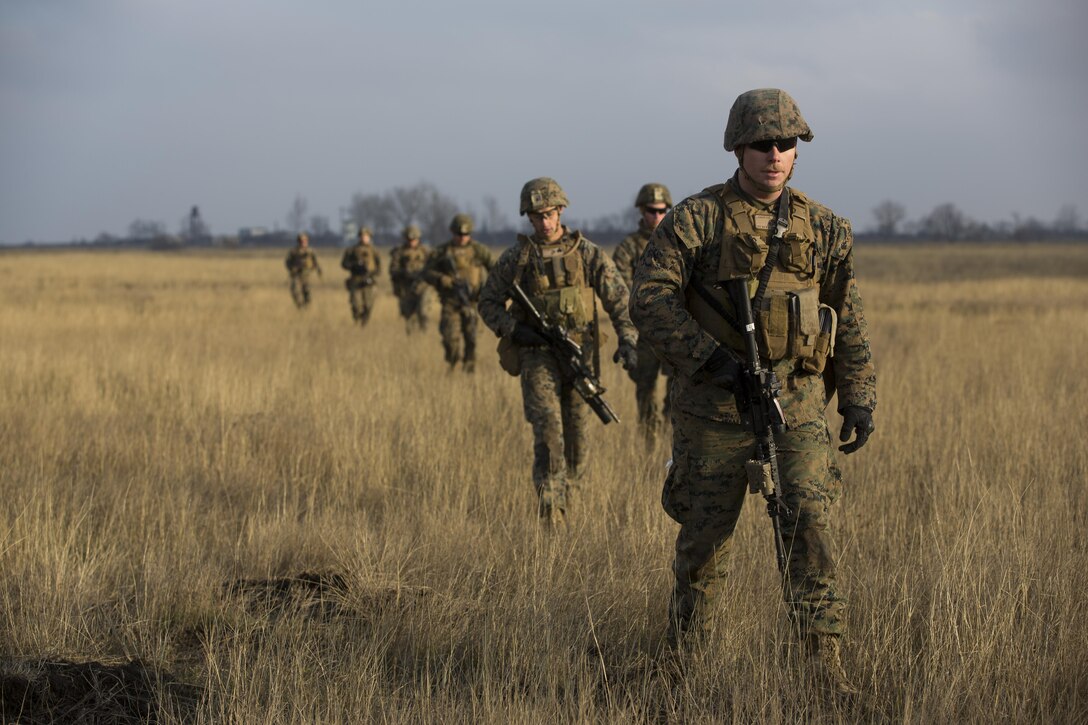 U.S. Marines with Combined Arms Company, Black Sea Rotational Force, conduct field training with Romanian and Moldovan armed forces during Platinum Lynx 16-2 at Smardan Training Area, Romania, Dec. 9, 2015. Exercise Platinum Lynx 16-2 is a NATO-led multinational exercise designed to strengthen combat readiness, increase improve collective capabilities, and maintain proven relationships with allied and partner nations. (U.S. Marine Corps photo by Lance Cpl. Melanye E. Martinez/Released)