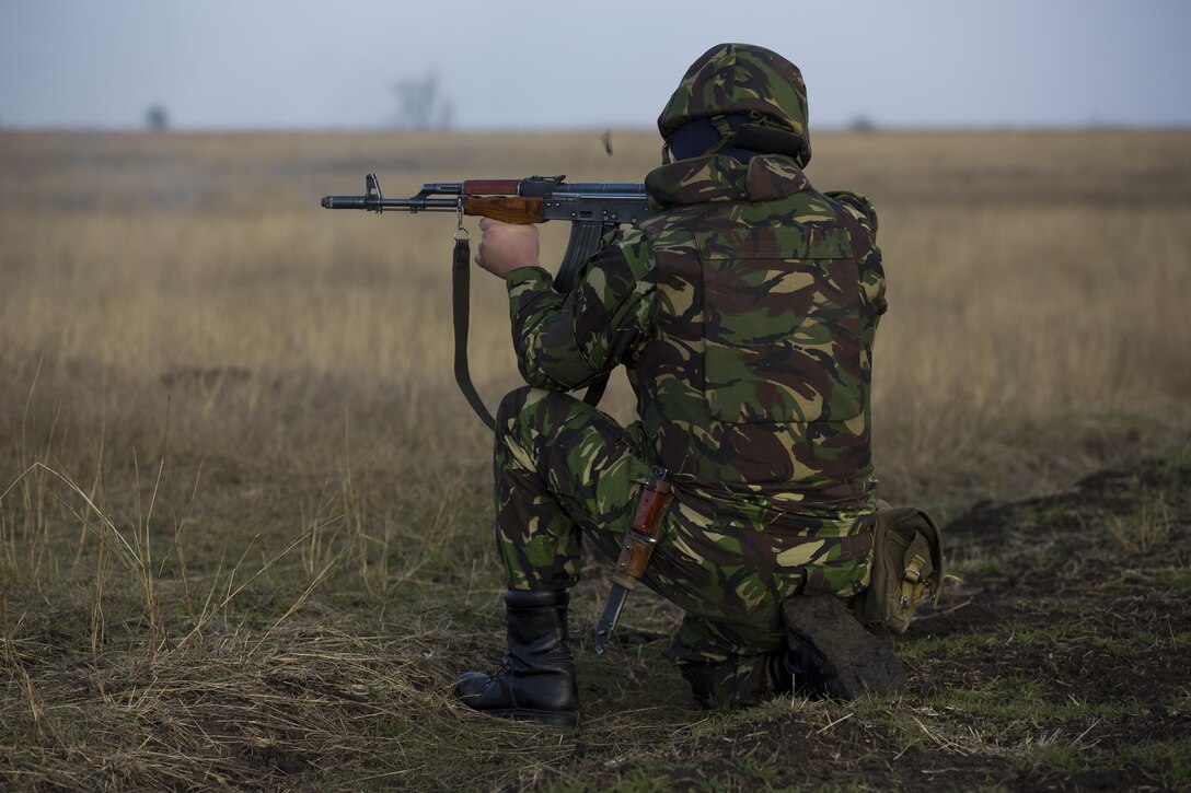 U.S. Marines with Combined Arms Company, Black Sea Rotational Force, conduct field training with Romanian and Moldovan armed forces during Platinum Lynx 16-2 at Smardan Training Area, Romania, Dec. 9, 2015. Exercise Platinum Lynx 16-2 is a NATO-led multinational exercise designed to strengthen combat readiness, increase improve collective capabilities, and maintain proven relationships with allied and partner nations. (U.S. Marine Corps photo by Lance Cpl. Melanye E. Martinez/Released)