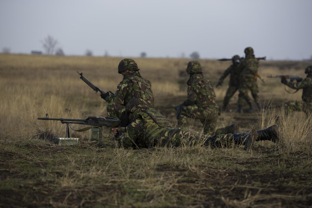 U.S. Marines with Combined Arms Company, Black Sea Rotational Force, conduct field training with Romanian and Moldovan armed forces during Platinum Lynx 16-2 at Smardan Training Area, Romania, Dec. 9, 2015. Exercise Platinum Lynx 16-2 is a NATO-led multinational exercise designed to strengthen combat readiness, increase improve collective capabilities, and maintain proven relationships with allied and partner nations. (U.S. Marine Corps photo by Lance Cpl. Melanye E. Martinez/Released)