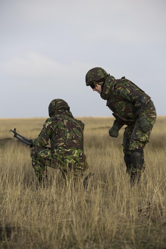 U.S. Marines with Combined Arms Company, Black Sea Rotational Force, conduct field training with Romanian and Moldovan armed forces during Platinum Lynx 16-2 at Smardan Training Area, Romania, Dec. 9, 2015. Exercise Platinum Lynx 16-2 is a NATO-led multinational exercise designed to strengthen combat readiness, increase improve collective capabilities, and maintain proven relationships with allied and partner nations. (U.S. Marine Corps photo by Lance Cpl. Melanye E. Martinez/Released)