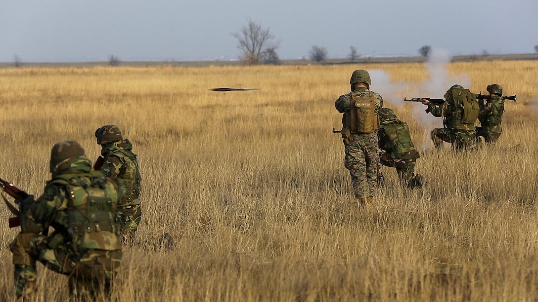 U.S. Marines with Combined Arms Company, Black Sea Rotational Force, conduct field training with Romanian and Moldovan armed forces during Platinum Lynx 16-2 at Smardan Training Area, Romania, Dec. 9, 2015. Exercise Platinum Lynx 16-2 is a NATO-led multinational exercise designed to strengthen combat readiness, increase improve collective capabilities, and maintain proven relationships with allied and partner nations. (U.S. Marine Corps photo by Lance Cpl. Melanye E. Martinez/Released)