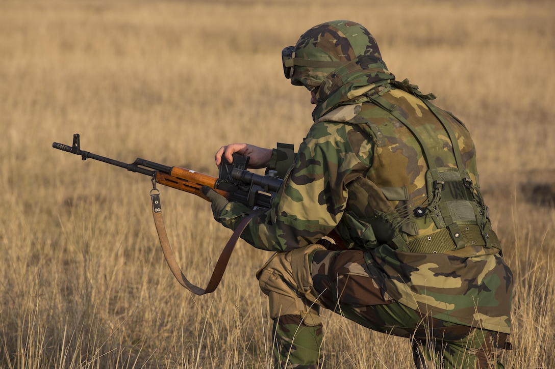 U.S. Marines with Combined Arms Company, Black Sea Rotational Force, conduct field training with Romanian and Moldovan armed forces during Platinum Lynx 16-2 at Smardan Training Area, Romania, Dec. 9, 2015. Exercise Platinum Lynx 16-2 is a NATO-led multinational exercise designed to strengthen combat readiness, increase improve collective capabilities, and maintain proven relationships with allied and partner nations. (U.S. Marine Corps photo by Lance Cpl. Melanye E. Martinez/Released)