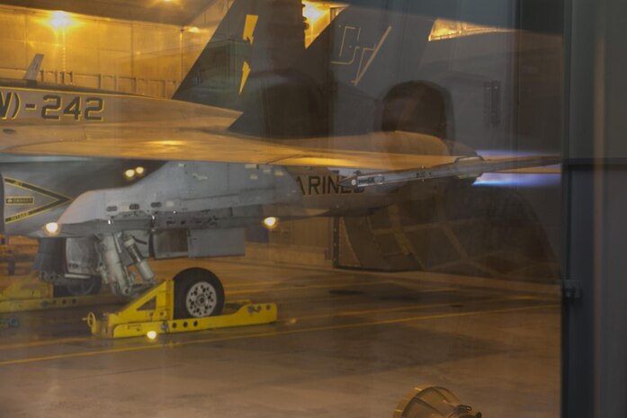 A Marine All-Weather Fighter Attack Squadron 242, VMFA(AW)-242, F/A-18D Hornet performs an engine test inside a hush house at Marine Corps Air Station Iwakuni, Japan, Dec. 14, 2015. These facilities are used to reduce noise in the local area when testing aircraft engines. Building and using facilities like these help strengthen the bond between the air station and the local community by showing that the station listens to the needs of the community and are doing their best to accommodate local citizens.