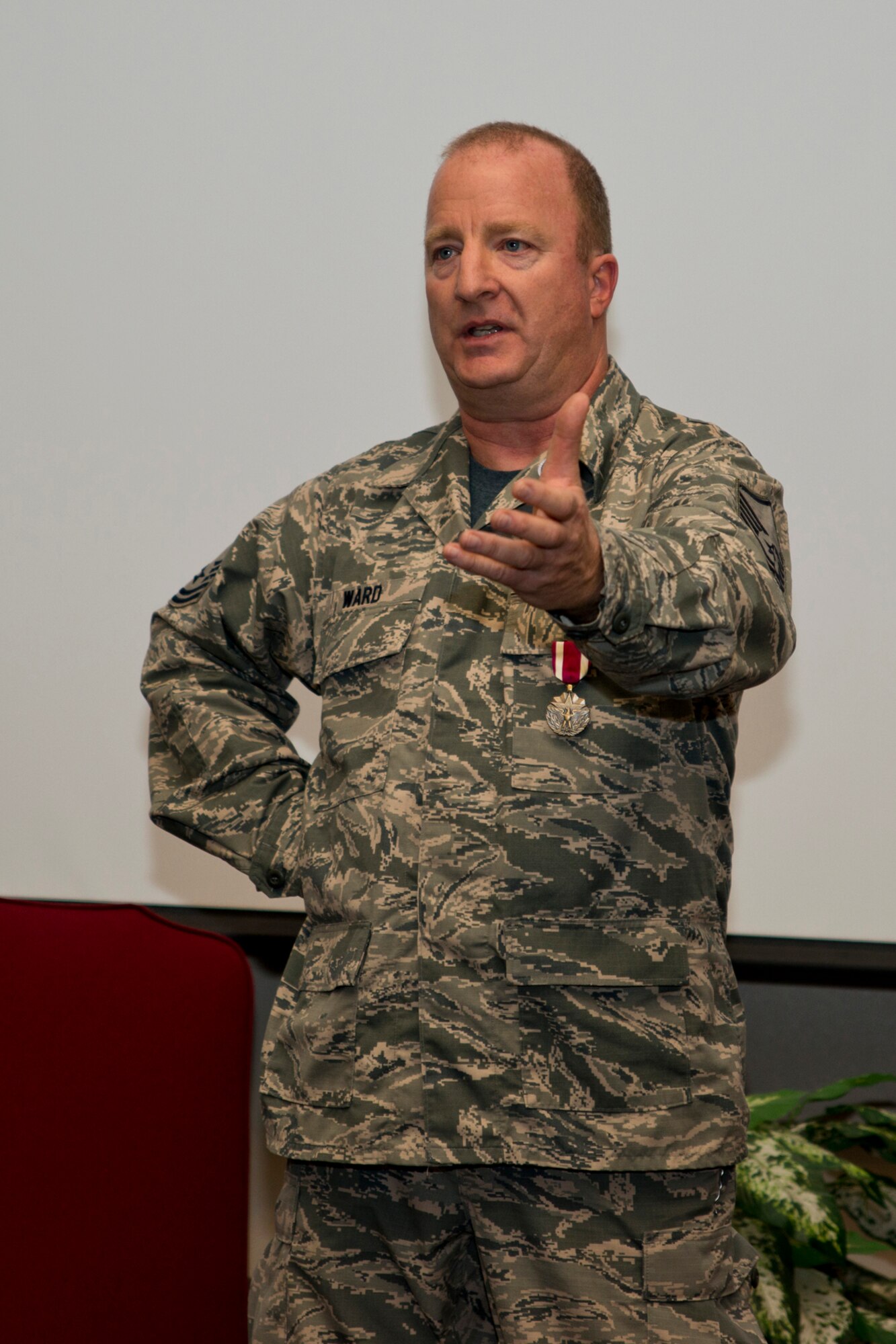 U.S. Air Force Retired Master Sgt. Michael Ward reflects on his military career during his retirement ceremony at Little Rock Air Force Base, Ark., Dec. 11, 2015. Ward retired with 32 years of military service and thanked his family, co-workers and friends for their support and respect throughout his career. (U.S. Air Force photo by Master Sgt. Jeff Walston/Released)     
