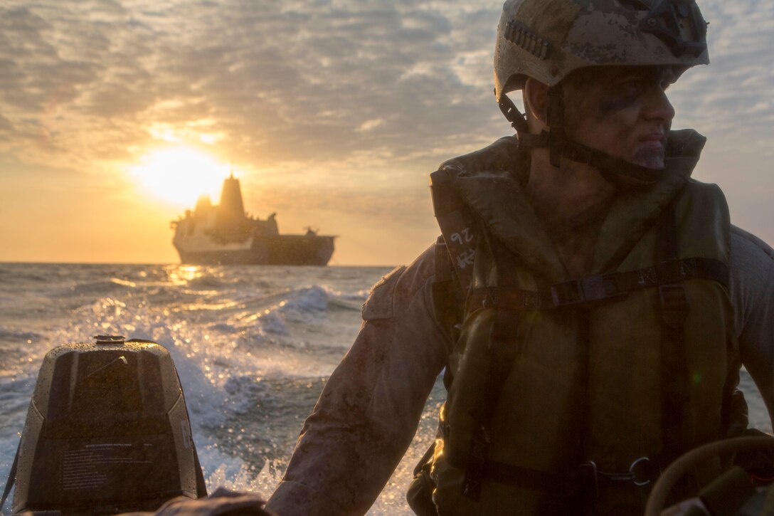 U.S. Marine Corps Lance Cpl. Chance Seckenger with Company F, Battalion Landing Team 2nd Battalion, 5th Marines, 31st Marine Expeditionary Unit (MEU), rides in a Combat Rubber Raiding Craft  during launch and recovery drills from the well deck of the USS Green Bay (LPD-20), at sea, July 9, 2015. Talisman Sabre is a major bilateral exercise that enhances the combat readiness and interoperability of U.S. and Australian forces across a range of military operations. (U.S. Marine Corps photo by Lance Cpl. Brian Bekkala/Released)
