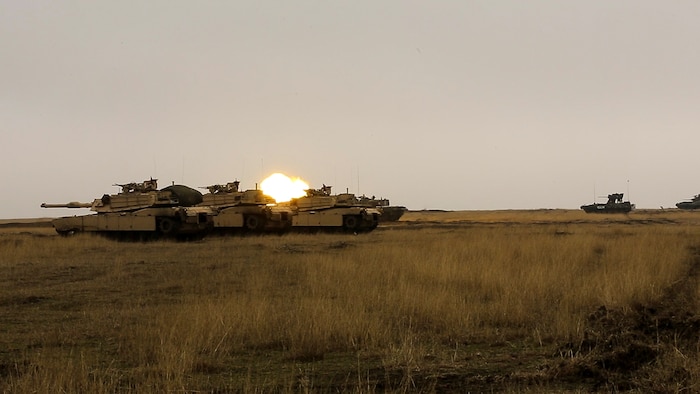U.S., Romanian and Moldovan military members participate in a tank shoot rehearsal during Platinum Lynx 16-2 at Smardan Training Area, Romania, Dec. 9, 2015. Exercise Platinum Lynx 16-2 is a NATO-led multinational exercise designed to strengthen combat readiness, increase improve collective capabilities, and maintain proven relationships with allied and partner nations