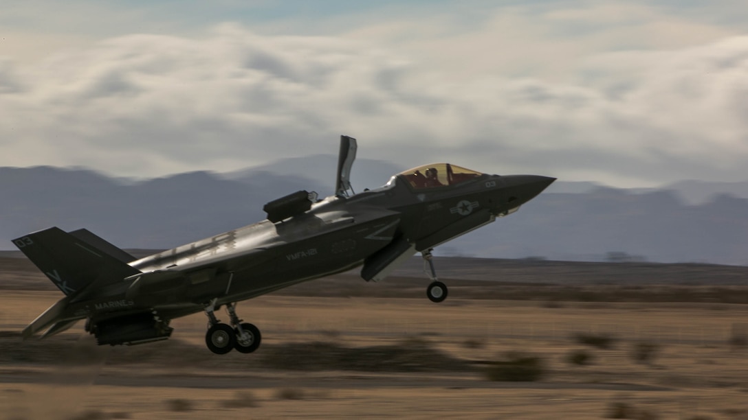 An F-35B Lightning II Joint Strike Fighter, Marine Fighter Attack Squadron 121, 3rd Marine Aircraft Wing,  performs a conventional take-off at the Strategic Expeditionary Landing Field during Exercise Steel Knight 2016 at Marine Corps Air Ground Combat Center Twentynine Palms, California, Dec. 11, 2015. This year’s iteration of Exercise Steel Knight works to advance 1st Marine Division’s warfighting capabilities, to include interoperability between the ground and air forces and integration of the F-35B.