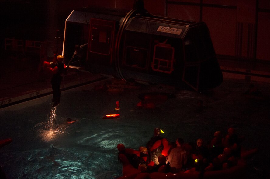 A water survival student is hoisted during a simulated rescue operation Dec. 8, 2015, at Fairchild Air Force Base, Wash. Students attended the survival school’s Water Survival Course to learn skills that will aid them if they become isolated personnel in open water, sea or ocean. (U.S. Air Force photo/Airman 1st Class Nick J. Daniello)