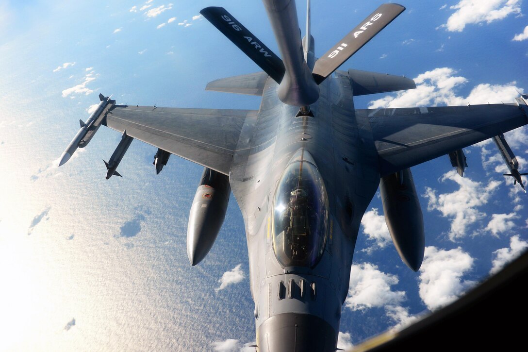 An F-16 Fighting Falcon receives fuel from a KC-135R Stratotanker during Exercise Razor Talon over the coast of North Carolina, Dec. 14, 2015. The aircrew and other support units from multiple bases conducted training missions designed to bolster cohesion between forces. U.S. Air Force photo by Senior Airman John Nieves Camacho