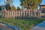 The 124th Medical Group poses for a group photo in front of the clinic Oct. 4, 2015 at Gowen Field, Boise, Idaho.