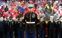 Sergeant Major Christopher A. Farrell, Marine Corps Recruiting Station Kansas City sergeant major, stands before a joint-service formation before the start of the Kansas City Chiefs' Military Appreciation Day game against the San Diego Chargers at Arrowhead Stadium, Dec. 13, 2015. Servicemembers from the Marine Corps, Army, Navy, Air Force, and Coast Guard were in attendance for the day's pregame and halftime festivities which included military vehicle static displays, joint-service color guard, and the Marine Corps Silent Drill Platoon.