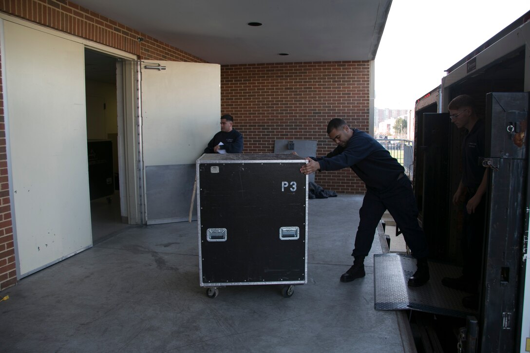 Marines from the stage crew load equipment into the truck for the United States Marine Band on Dec. 8, 2015, at Marine Barracks Washington, D.C. The stage crew directs the loading, transportation, and set-up of musical instruments and equipment for more than 500 public performances by “The President’s Own” in the Washington, D.C. area, and across the nation during tour. 