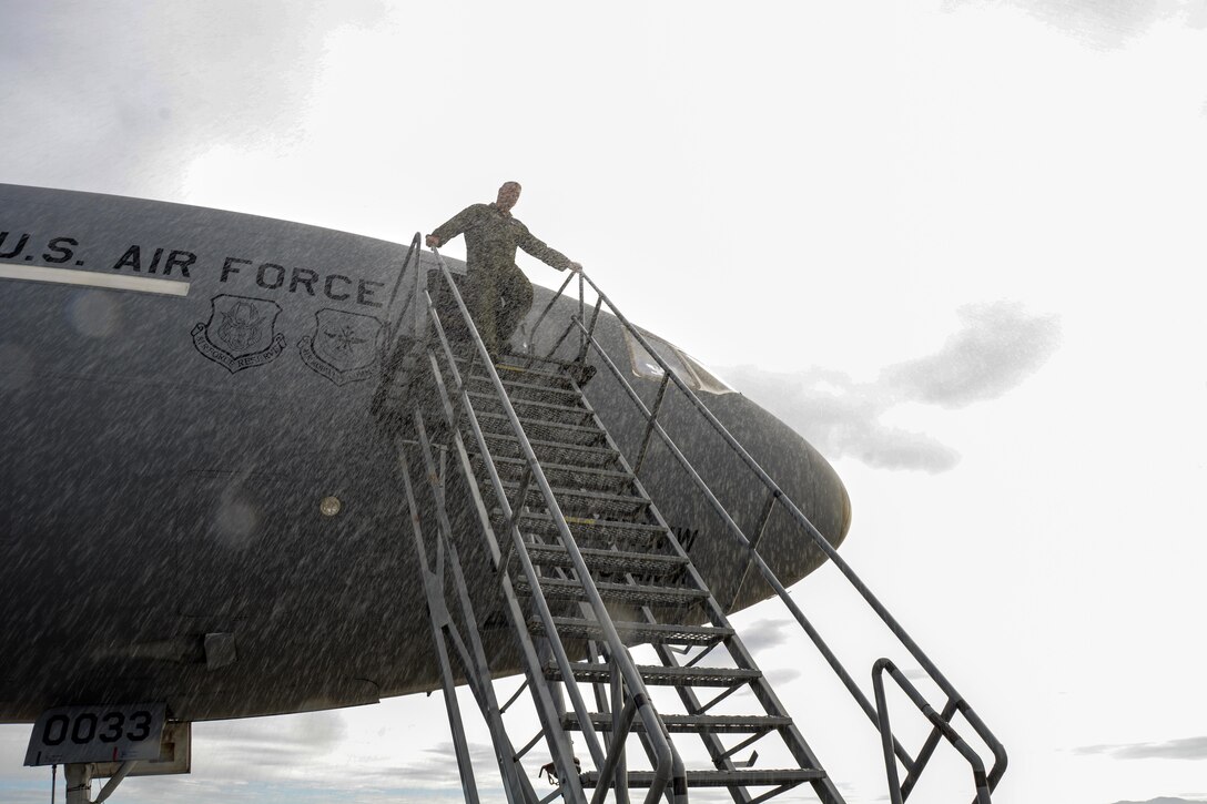Col. Patrick T. Williams, 349th Air Mobility Wing vice commander, completes the traditional Air Force Fini Flight Dec. 12, 2015 at Travis Air Force Base. 