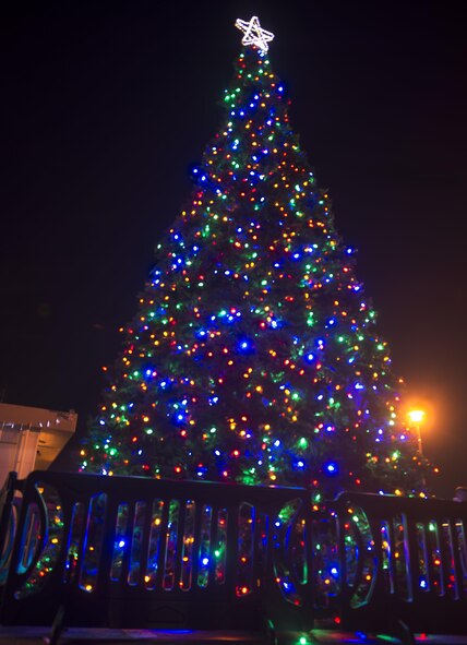 Kadena's Christmas tree is illuminated during the tree-lighting ceremony at Kadena Air Base, Japan, Dec.12, 2015. The tree lighting is an annual tradition performed during Tinsel Town and is hosted by members of Kadena dressed as Santa and Mrs. Claus. (U.S. Air Force photo by Senior Airman Omari Bernard)