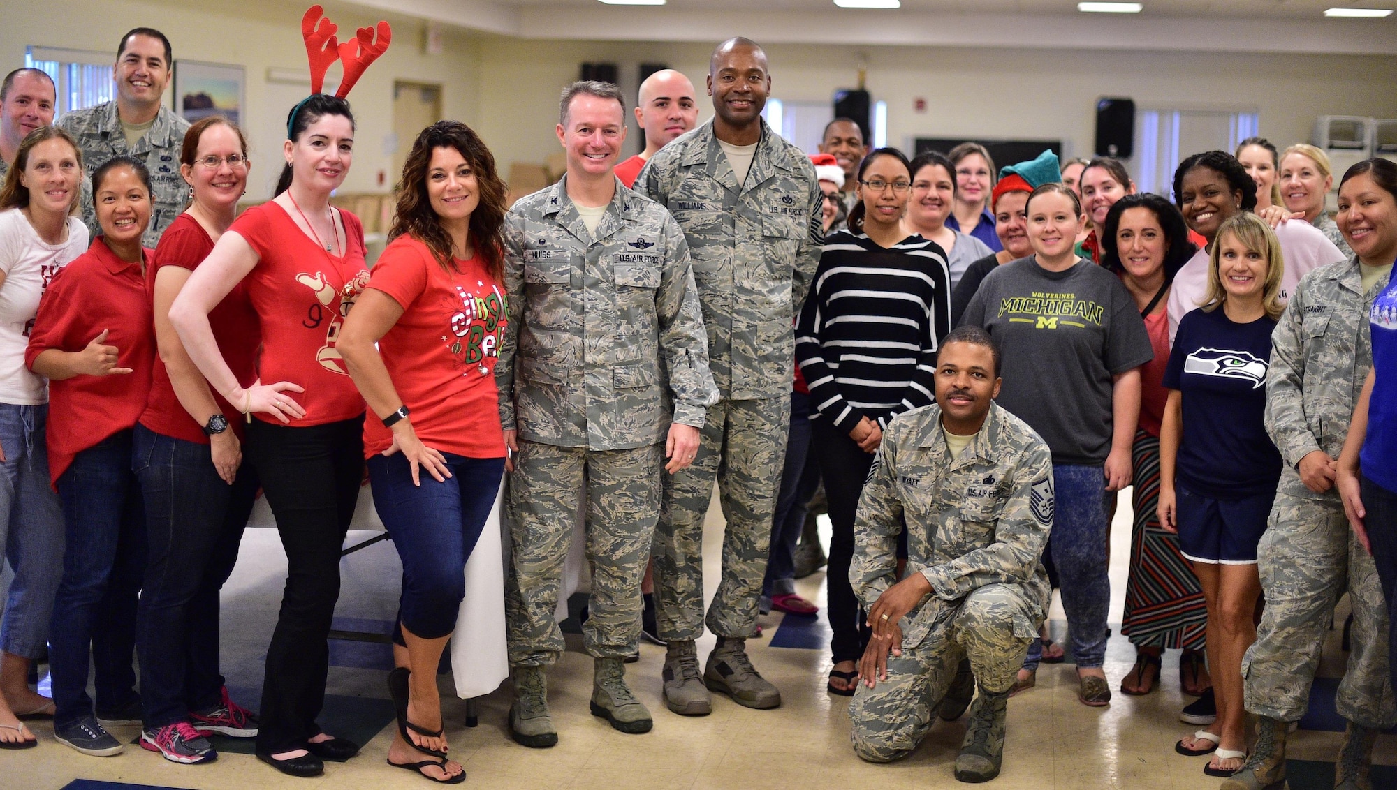 Colonel Randall Huiss,15th Wing commander and Command Chief Master Sgt. Jerry L. Williams, Jr., teamed up with JBPHH personnel, spouses and children to bake, decorate and package more than 13,000 cookies as part of the annual ‘cookie caper’ event, held at the Earhart Community Center, Dec. 10, 2015. The event is an annual tradition of where volunteers from the Team Hickam community come together and donate homemade cookies for all single and deployed Airmen. (U/S. Air Force photo by Staff Sgt. Christopher Stoltz/released)