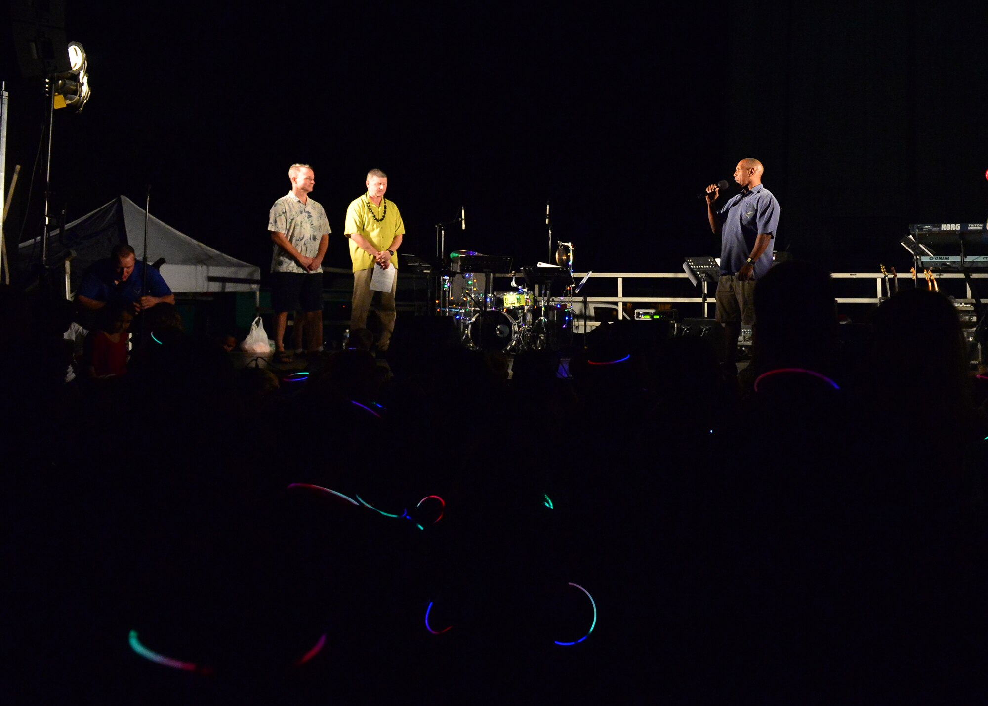 CAPT Stanley Keeve, commander, Joint Base Pearl Harbor-Hickam, talks to the service members and their families during the 46th Annual Freedom Tower Lighting celebration held on JBPHH, Hawaii, Dec. 11, 2015. Over 5,000 lights illuminate the 178-foot Freedom Tower. (U.S. Air Force photo by Tech. Sgt. Aaron Oelrich/Released)