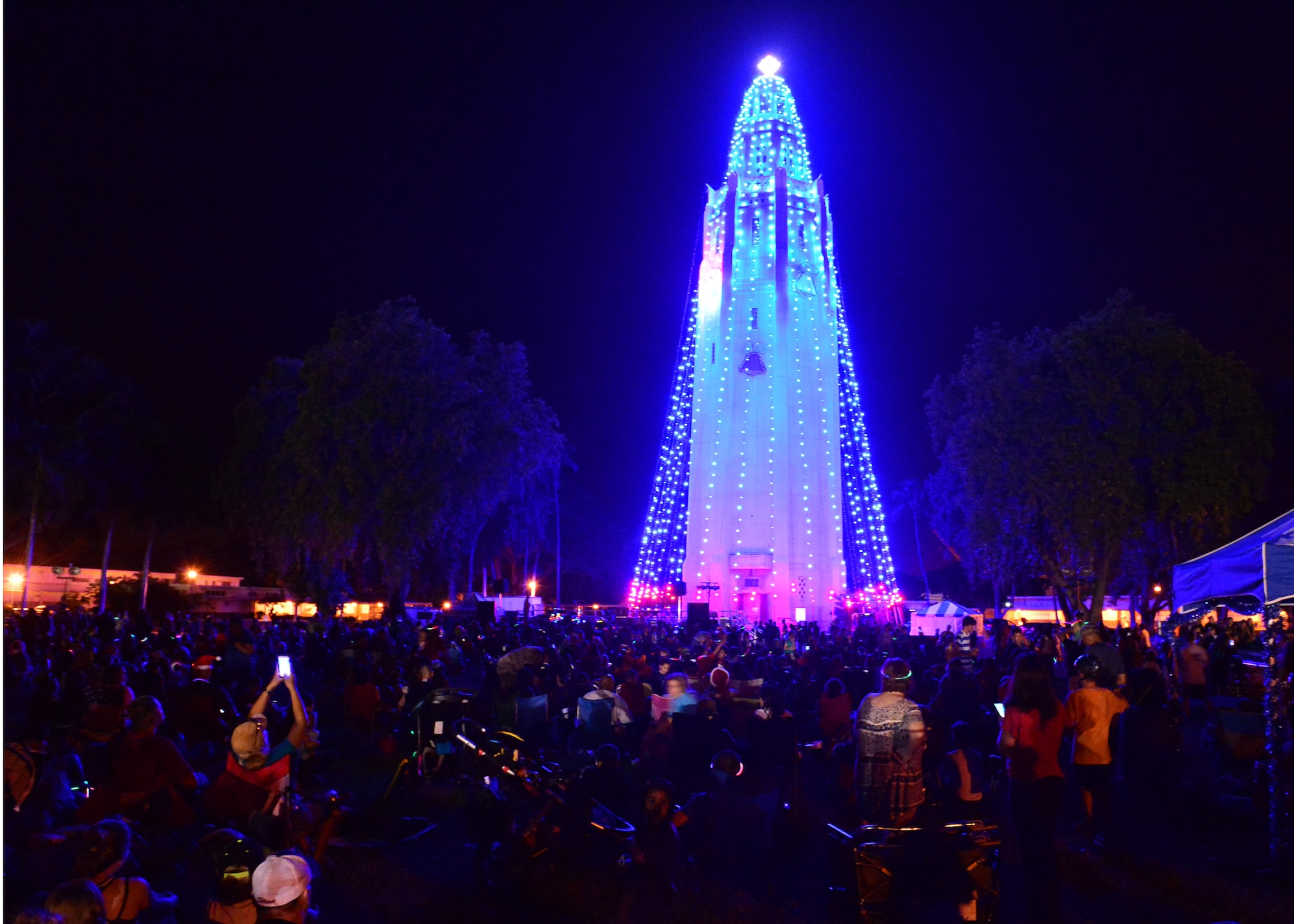 Nearly 4,000 service members and their families attended the 46th Annual Freedom Tower Lighting celebration on Joint Base Pearl Harbor-Hickam, Hawaii, Dec. 11, 2015. Over 5,000 lights illuminate the 178-foot Freedom Tower r. (U.S. Air Force photo by Tech. Sgt. Aaron Oelrich/Released)