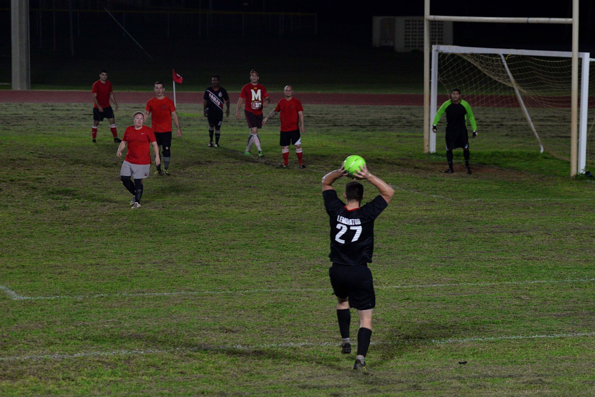 Senior Airman David Lemon, 36th Air Mobility Squadron, throws in the soccer ball during the intramural soccer championship Dec. 14, 2015, at Andersen Air Force Base, Guam. Since the beginning of the season in November, the 36th Expeditionary Aircraft Maintenance Squadron beat out seven other teams to reach the championship game. (U.S. Air Force photo/Airman 1st Class Alexa Ann Henderson)