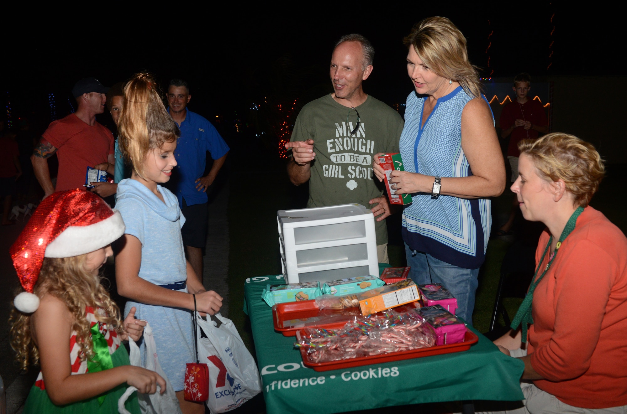 Children receive candy at the Girl Scouts booth during the annual Rota Walk Dec. 12, 2015, at Andersen Air Force Base, Guam. Candy and other prizes were handed out to Rota Walk attendees during the event. (U.S. Air Force photo/Airman 1st Class Arielle Vasquez)