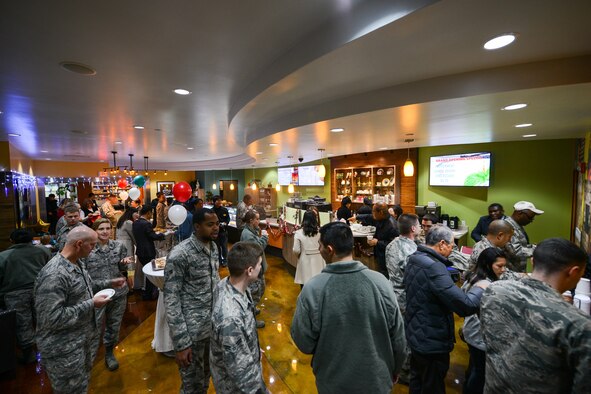 Members of Team Osan gather during the Mustang Café grand opening at Osan Air Base, Republic of Korea, Dec. 15, 2015. The café, located in the Mustang Resiliency Center, provides Team Osan with a location for social groups to gather. (U.S. Air Force photo/Airman 1st Class Dillian Bamman)