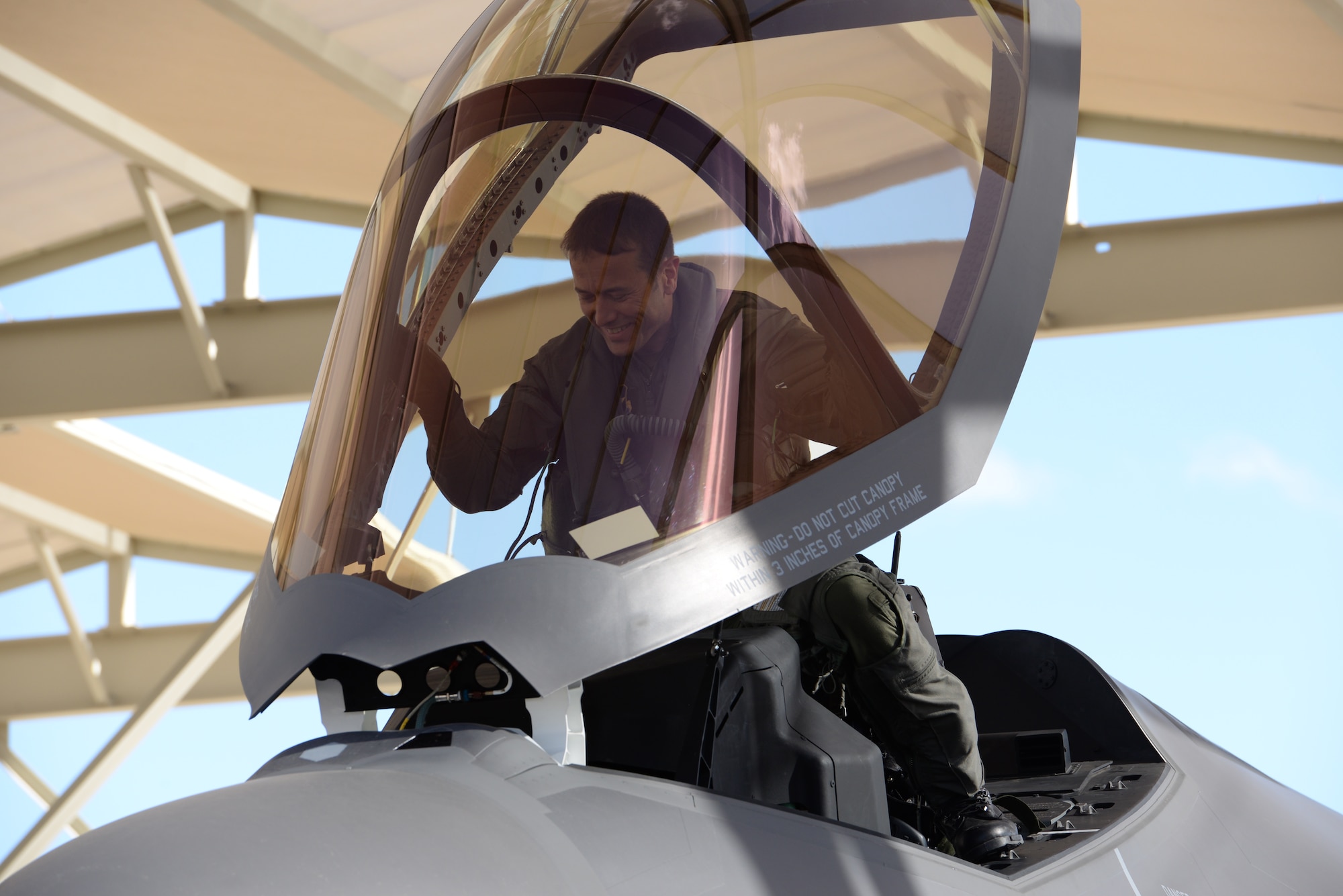 Norwegian Maj. Morten Hanche, 62nd Fighter Squadron F-35 student pilot, smiles as he enters the cockpit of a Norwegian F-35 for the first time, Dec. 14, 2015, at Luke Air Force Base. Hanche made history as the first Norwegian to ever pilot an F-35. (U.S. Air Force photo by Airman 1st Class Ridge Shan)