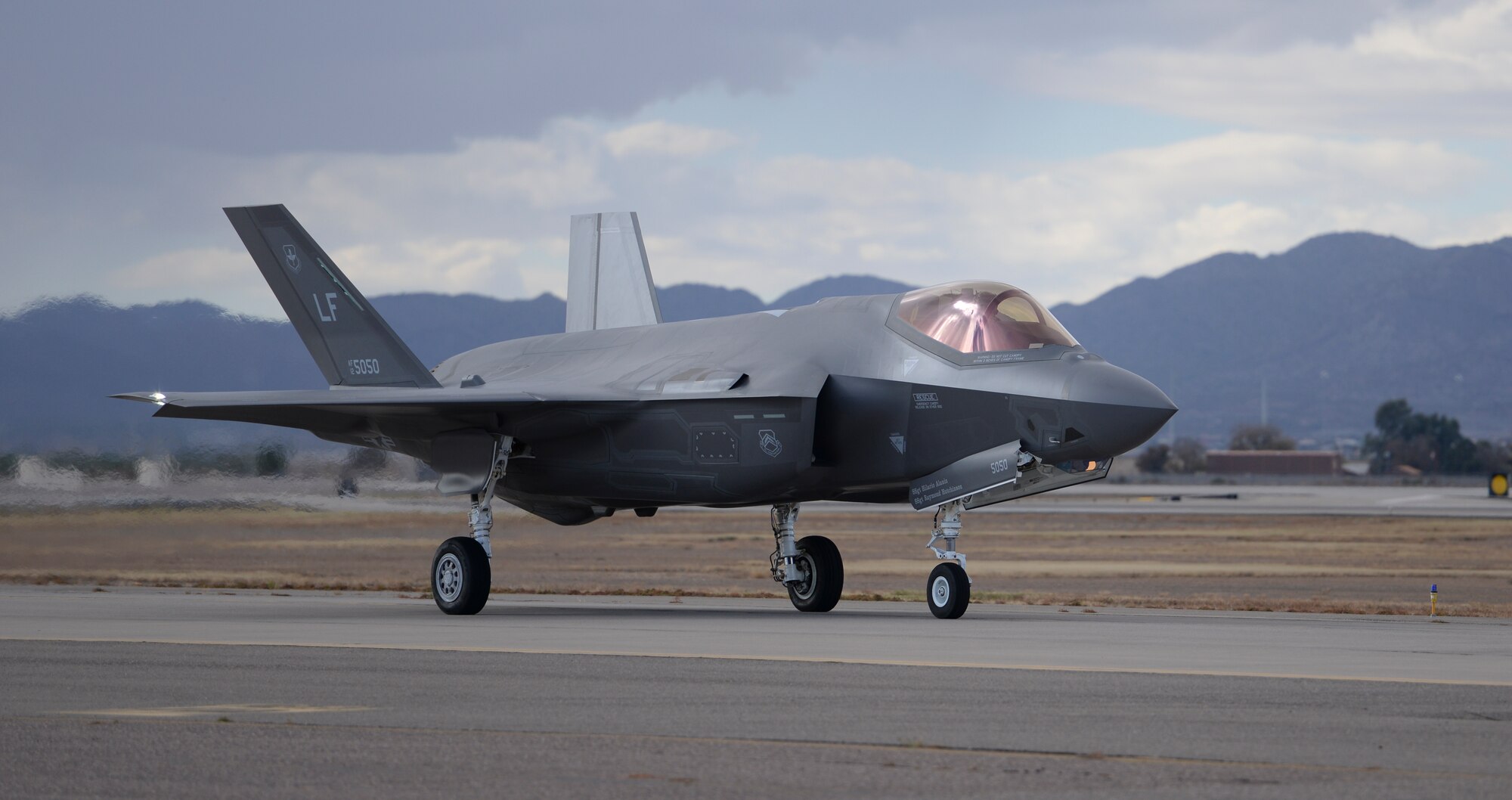 An F-35 taxis from the runway onto the flightline after successfully completing a sortie, Dec. 14, 2015, at Luke Air Force Base. The F-35 Lightning II is the most advanced fighter aircraft ever fielded, and is being adopted internationally by the United States and eight partner nations including Norway, Italy, and Australia. (U.S. Air Force photo by Airman 1st Class Ridge Shan)