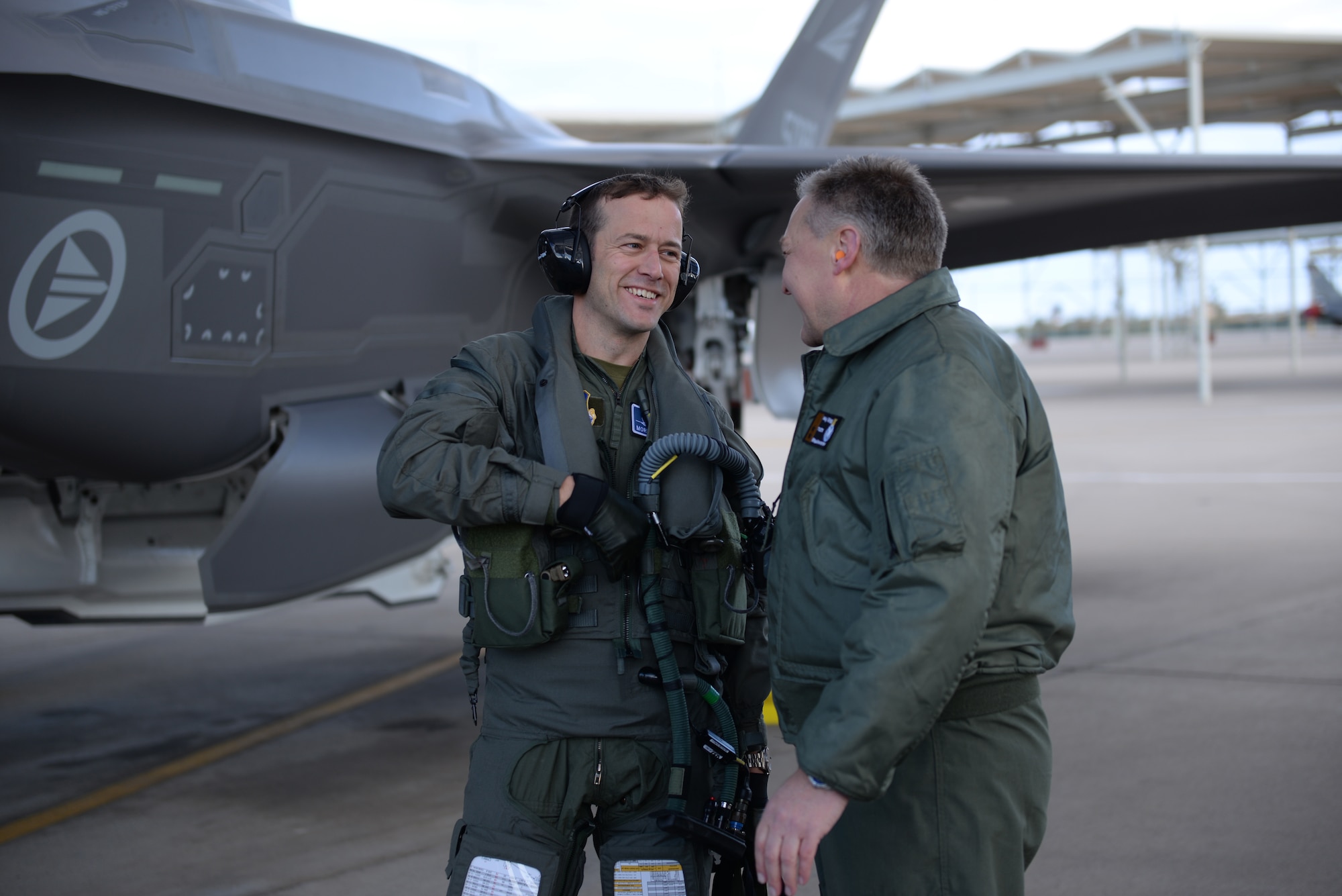 Norwegian Maj. Morten Hanche, 62nd Fighter Squadron student pilot, is congratulated by Maj. Gen. Per-Egil Rygg, Royal Norwegian air force chief of staff, after successfully completing a sortie in a Norwegian F-35, the first ever by a Norwegian pilot, Dec. 14, 2015, at Luke Air Force Base. (U.S. Air Force photo by Airman 1st Class Ridge Shan)